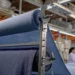 textile manufactory big machines navy blue fabric processing