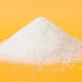 benzoic acid powder on yellow background